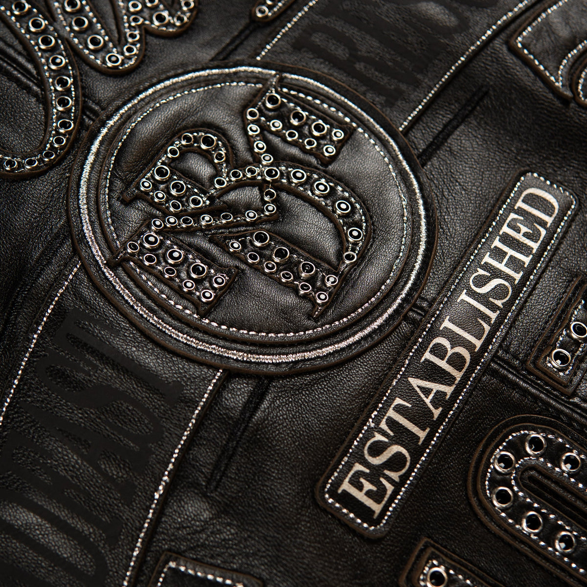 Black leather jacket with studded Pelle Pelle lettering,