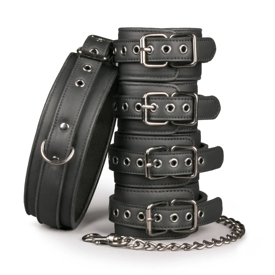 Black genuine leather cuff set with four adjustable buckle cuffs, a matching collar, metal eyelets, attachment rings and chain connectors.