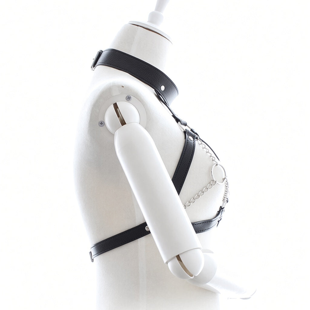 Side view of black leather collar chest harness showing chain detailing, metal rings, stitched straps and an adjustable rear buckle closure.