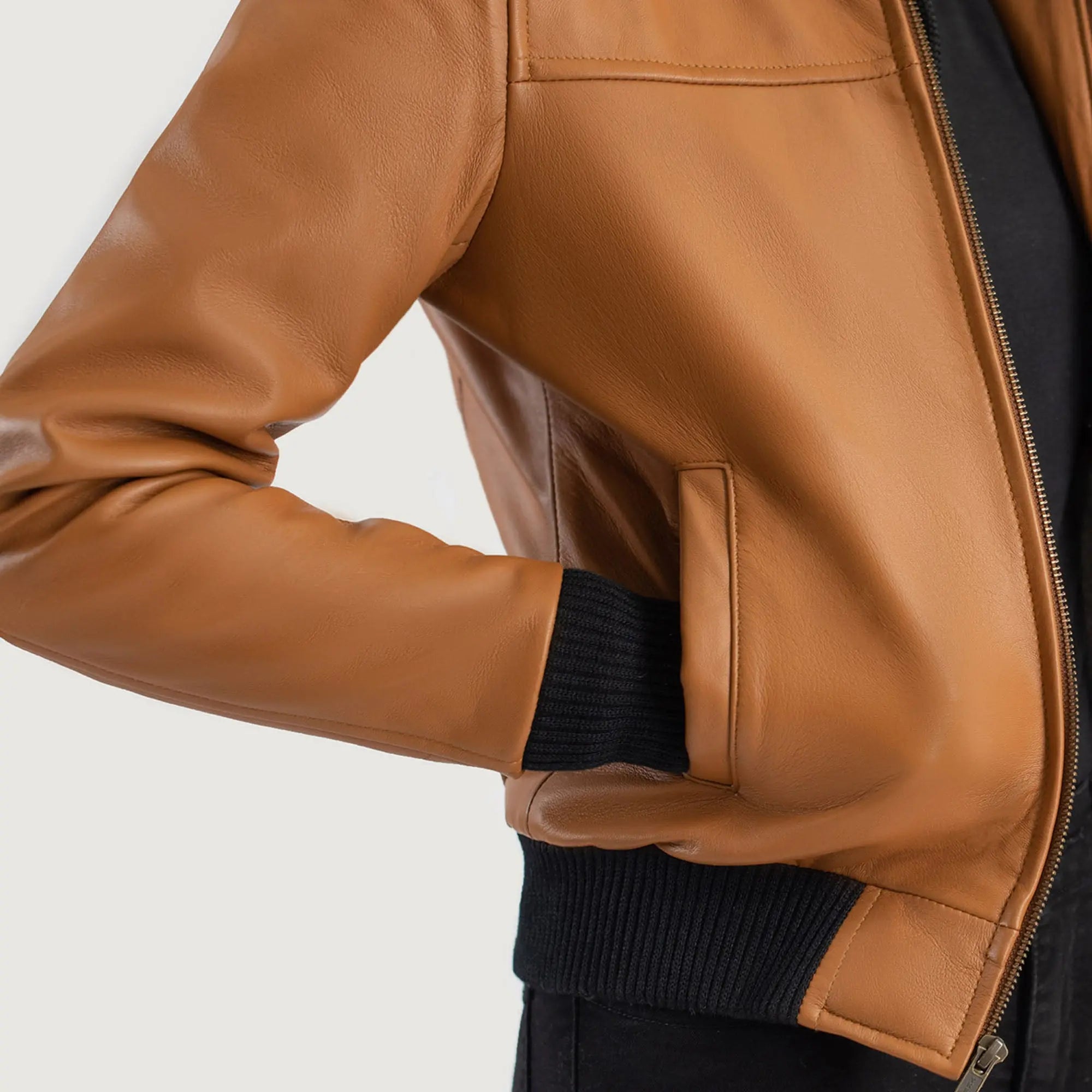 Close up brown leather bomber jacket hood zipper detail shot