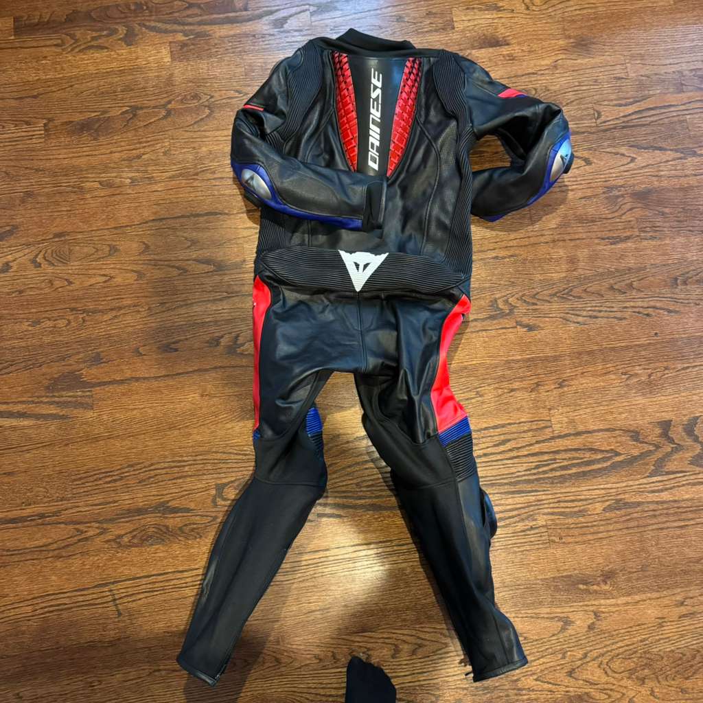 Dainese-inspired motorcycle leather suit with breathable lining and professional rider protection