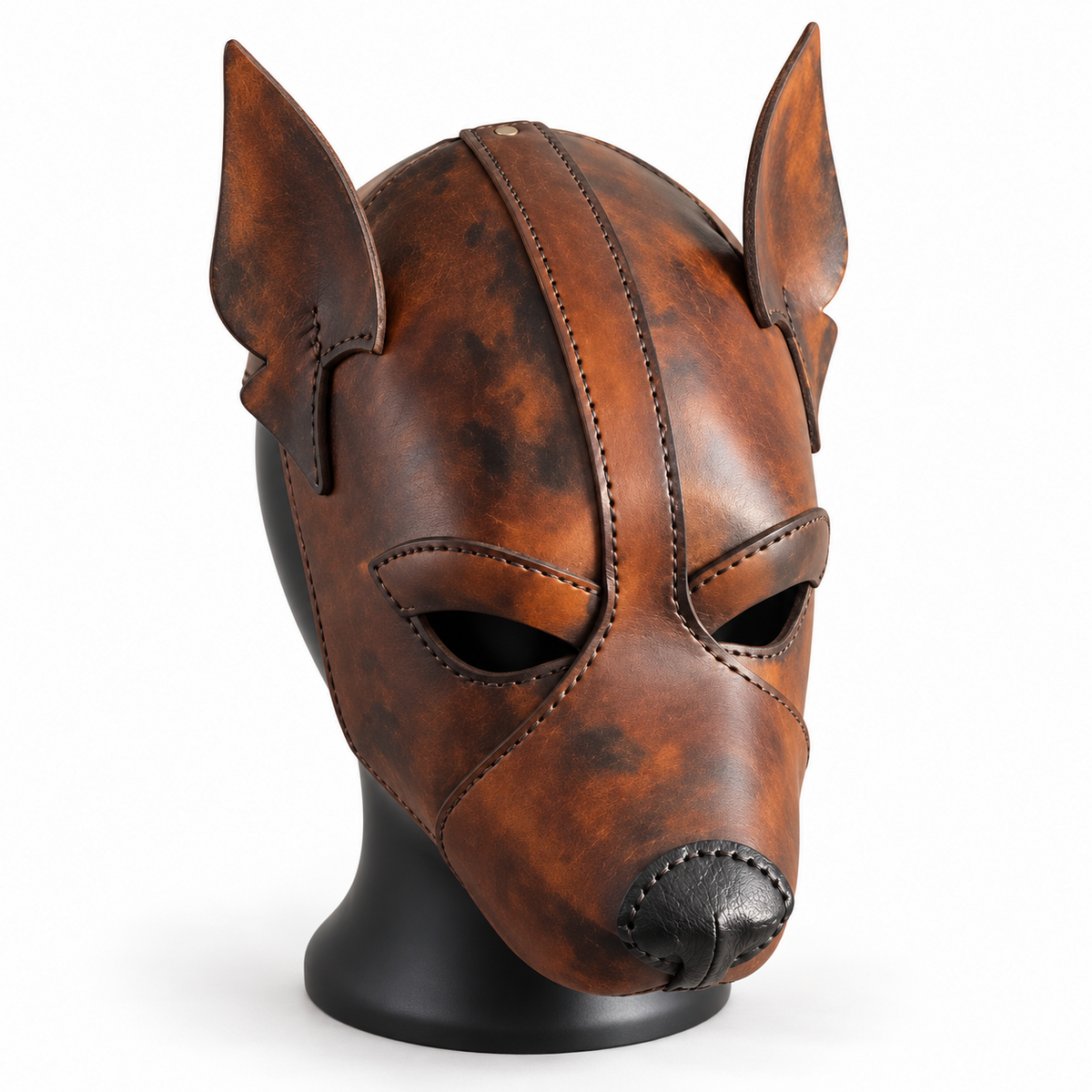 Front angled view of a distressed brown leather canine mask with tall ears, stitched forehead strip, open eye cutouts and shaped black nose.