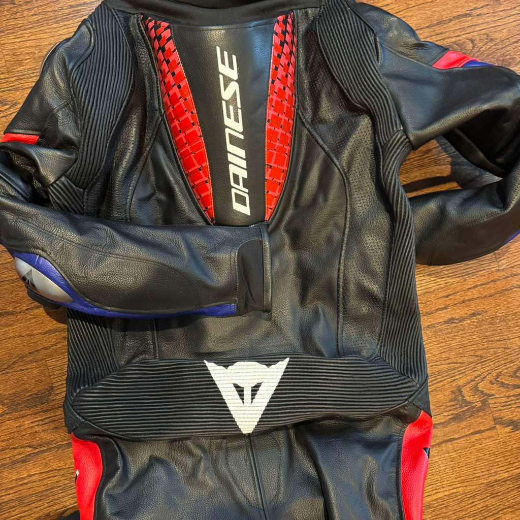 Handmade racing suit designed for track riding with genuine cowhide leather and protective armor zones