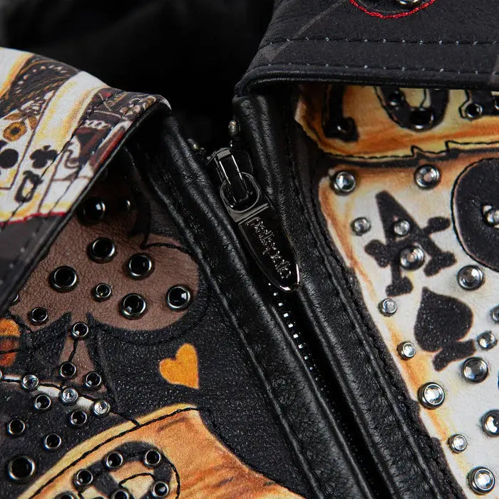 Detailed sleeve artwork on black leather crop jacket with red cards, dice, and poker graphics
