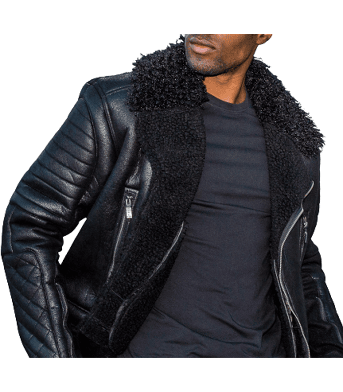 Men's black leather biker jacket, upper body close-up, showing a broad plush collar, asymmetric zipper, and contrasting quilted sleeve panels.