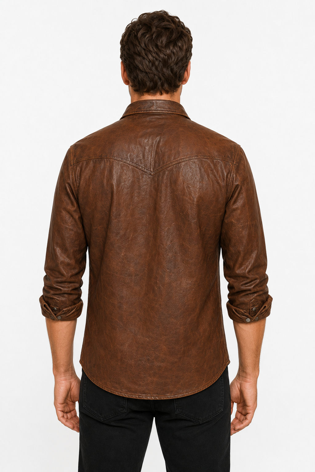 Rear view of men’s distressed brown leather western shirt showing a pointed back yoke, curved shirttail hem and rolled sleeves with snap cuffs.