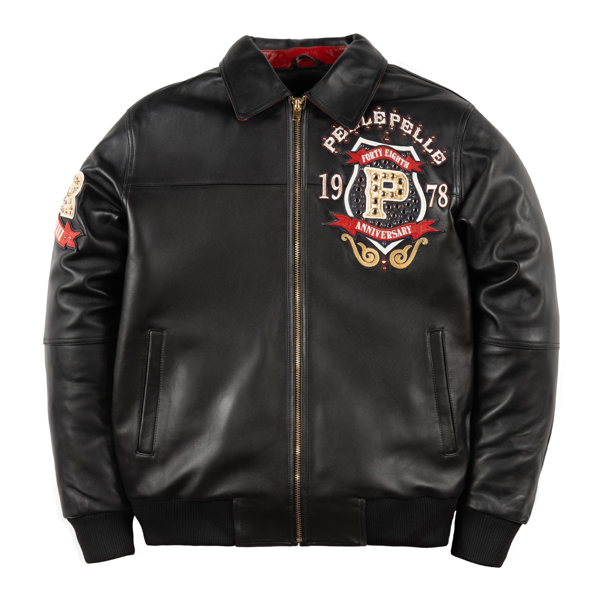 Front view of a black leather anniversary jacket with a decorated chest crest, gold-tone zipper and two angled pockets