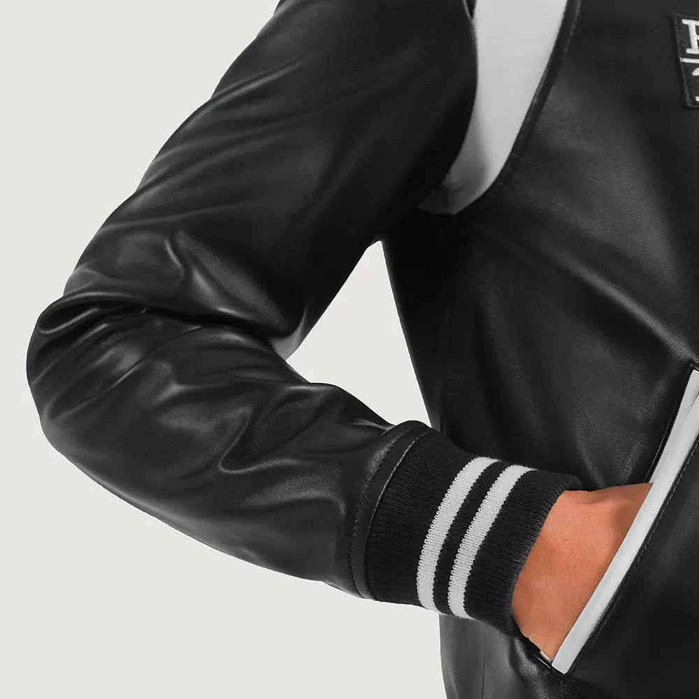Premium black leather varsity jacket close detail stitching.