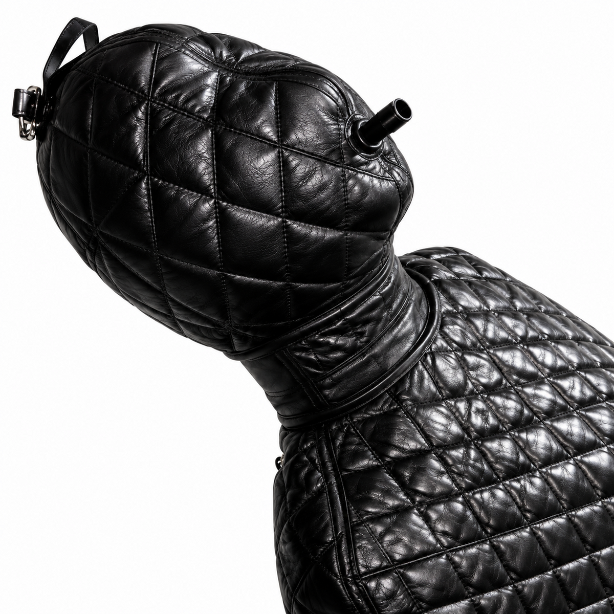 Quilted black leather hood and upper body detail with diamond stitching, broad neck band, metal hardware and a projecting tubular fitting.