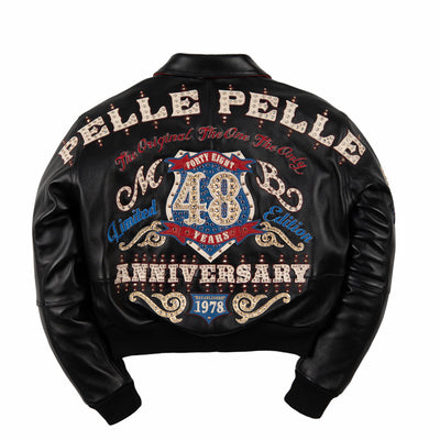 Women's black leather anniversary bomber jacket, back view, with red and blue crest artwork and decorative gold-toned accents.