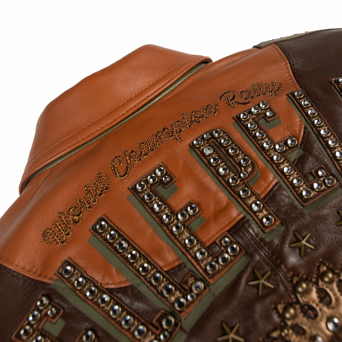Women's brown colorblock leather racing jacket, upper back lettering detail, with caramel and olive panels and decorative metallic accents.