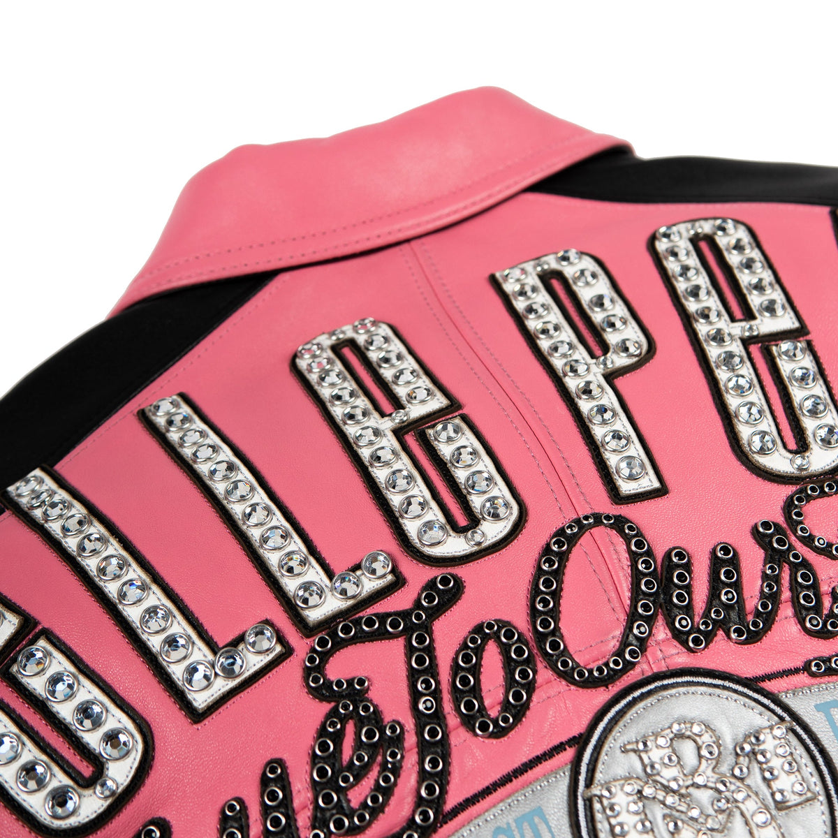 Women's pink and black leather varsity jacket, upper back lettering, featuring contrast panels and decorative lettering in the product photo.