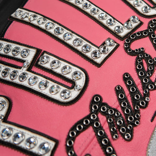Women's pink and black leather varsity jacket, letter embellishment detail, featuring contrast panels and decorative lettering in the product photo.