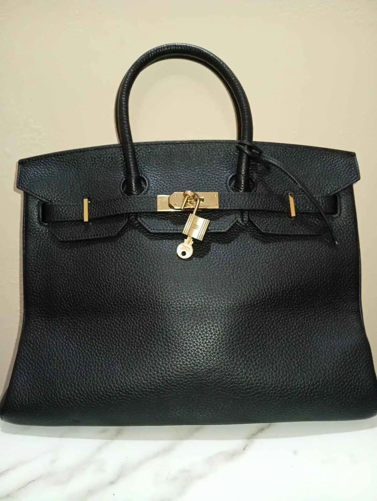 Luxury Black Hermรจs Birkin 30 Togo Leather Handbag with Gold Hardware | Leather Taboo