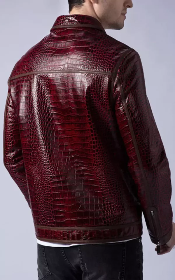 Rear three-quarter view of men's burgundy crocodile textured genuine leather jacket, showing the back panels, collar and sleeve trim.