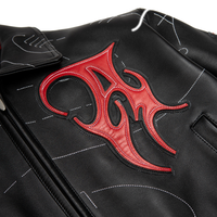 Women's black leather contour stitch bomber jacket, detailed view of the red chest applique outlined by white stitching on black panels.