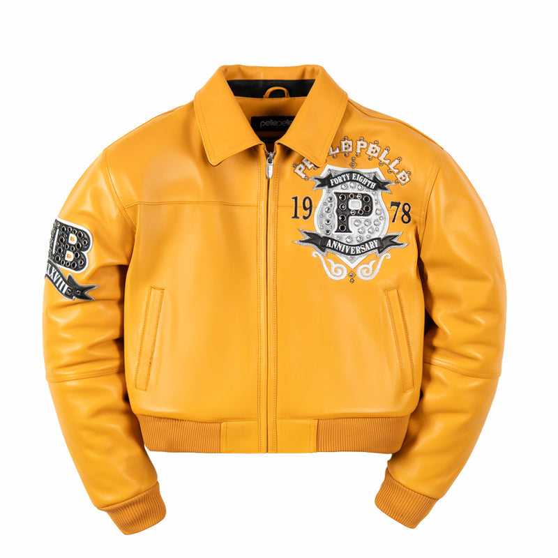 Front of women's maize yellow genuine leather jacket with embellished chest crest, pointed collar, zip front and ribbed cuffs.