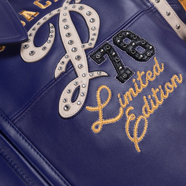 Chest detail of purple leather varsity jacket with cream script P, black 78 applique, metallic accents and gold embroidered lettering.