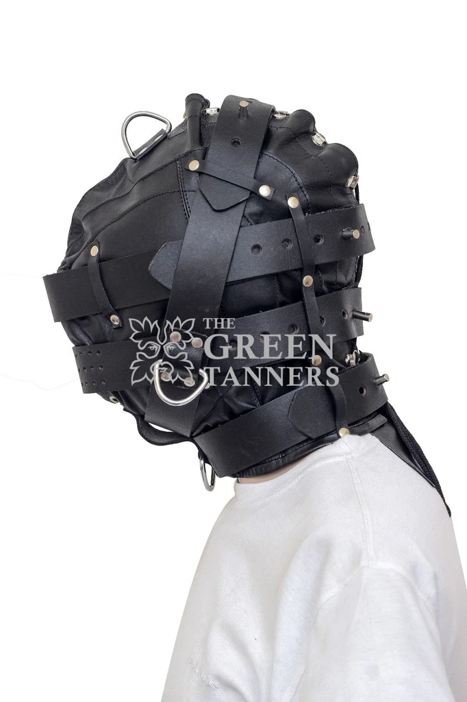 Side view of a black leather hood with layered adjustable straps, metal stud fastenings, silver-tone rings and a perforated face band.