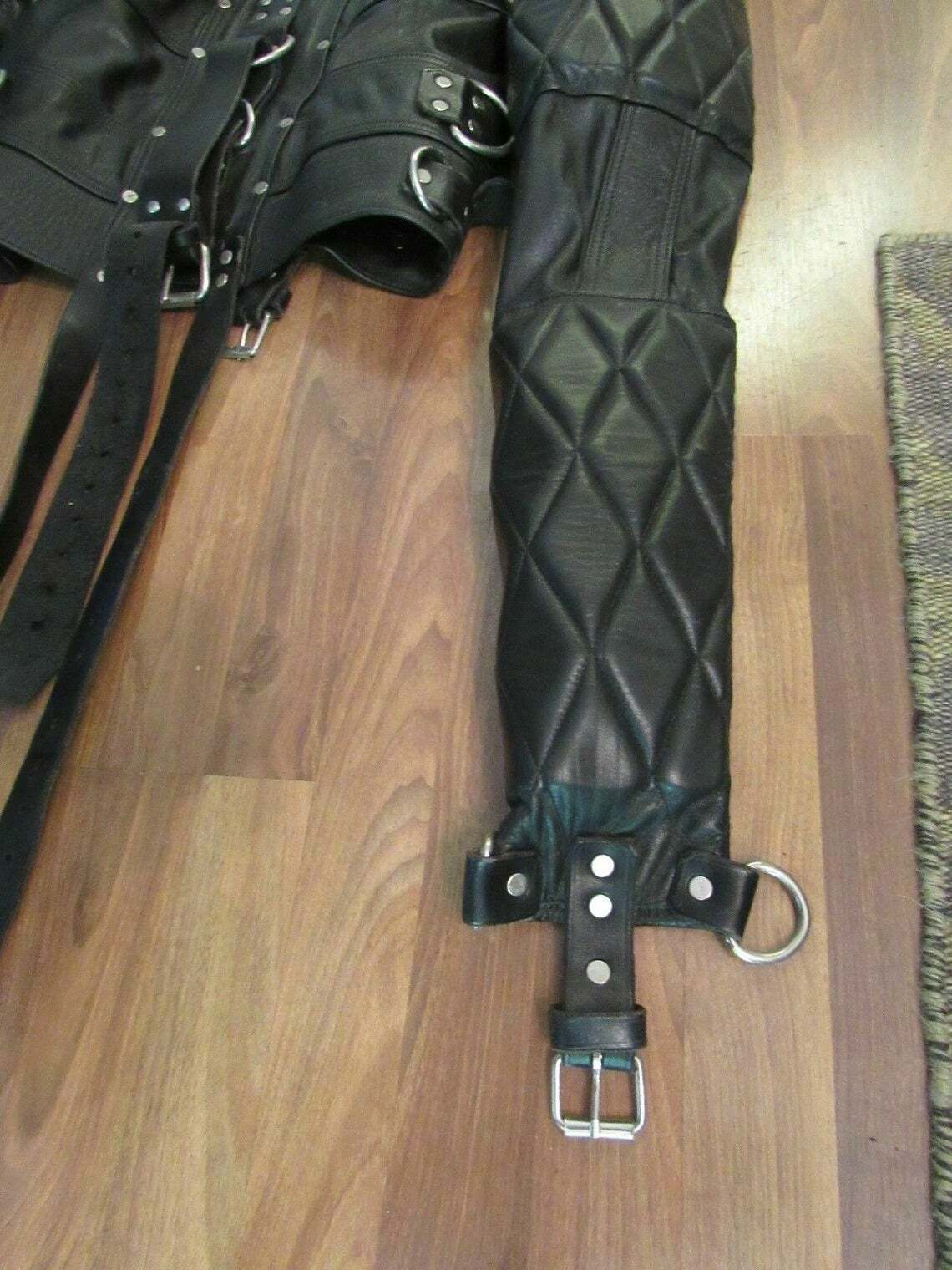 Handmade leather cosplay jacket with arm binder style straps