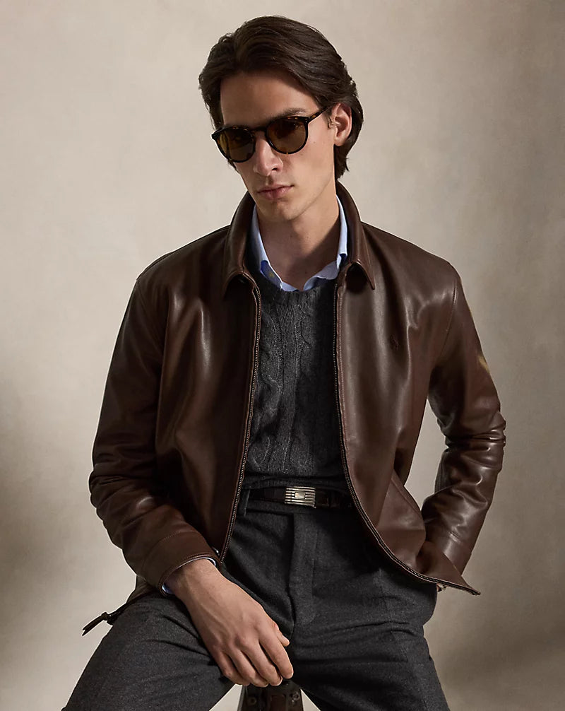 Front view of men's chocolate brown leather zip jacket with a pointed shirt collar, lower welt pockets, long sleeves and a straight hem.