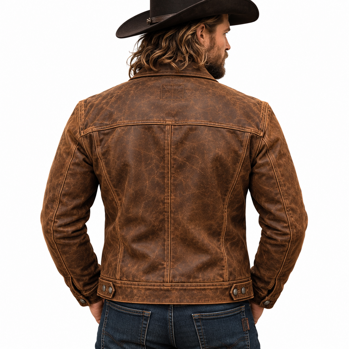 Men’s distressed brown leather trucker jacket rear view showing a horizontal yoke, vertical panel seams, button cuffs and waist adjustment tabs.