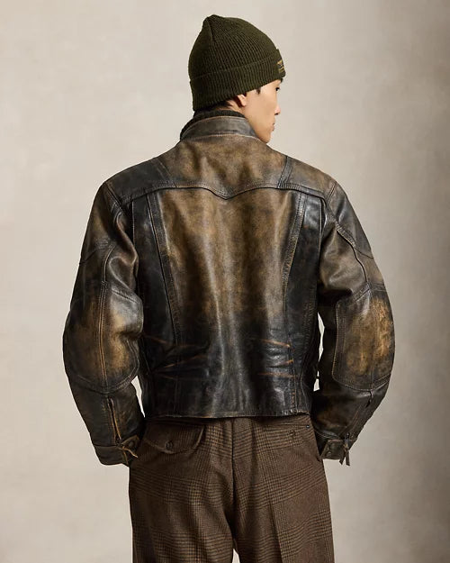 Rear view of men's distressed brown leather cafe racer jacket showing the shaped shoulder yoke, vertical seams and defined elbow panels.