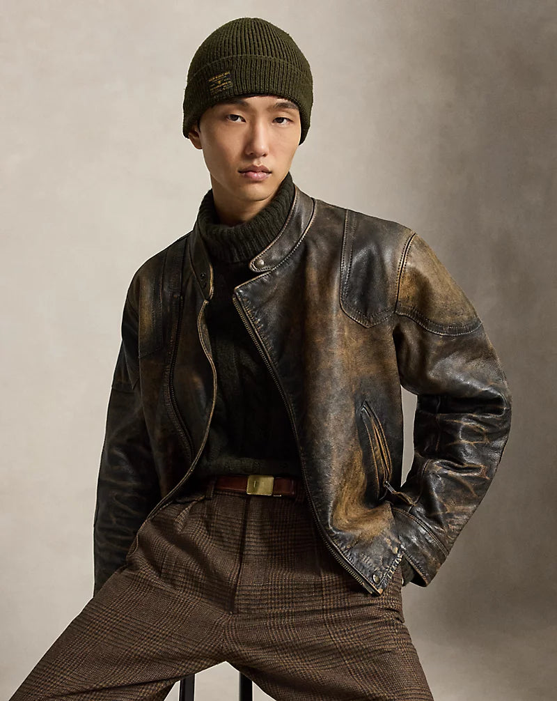 Front view of men's distressed dark brown leather cafe racer jacket with a snap stand collar, metal front zipper and shaped shoulder panels.