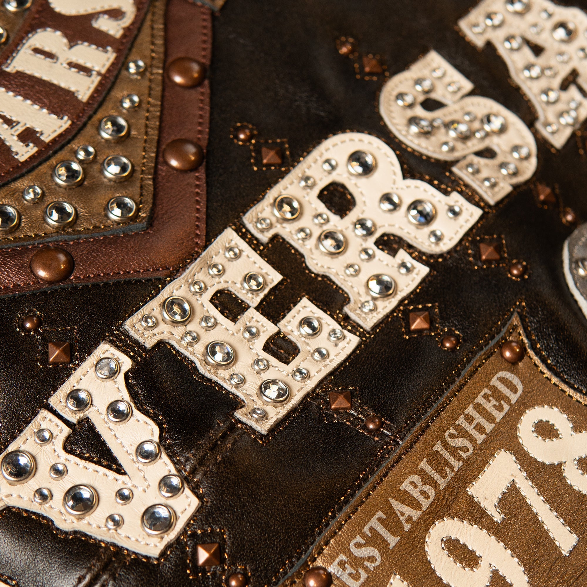 genuine cowhide leather, distressed antique-brown finish with lighter rub-through at the seams and edges