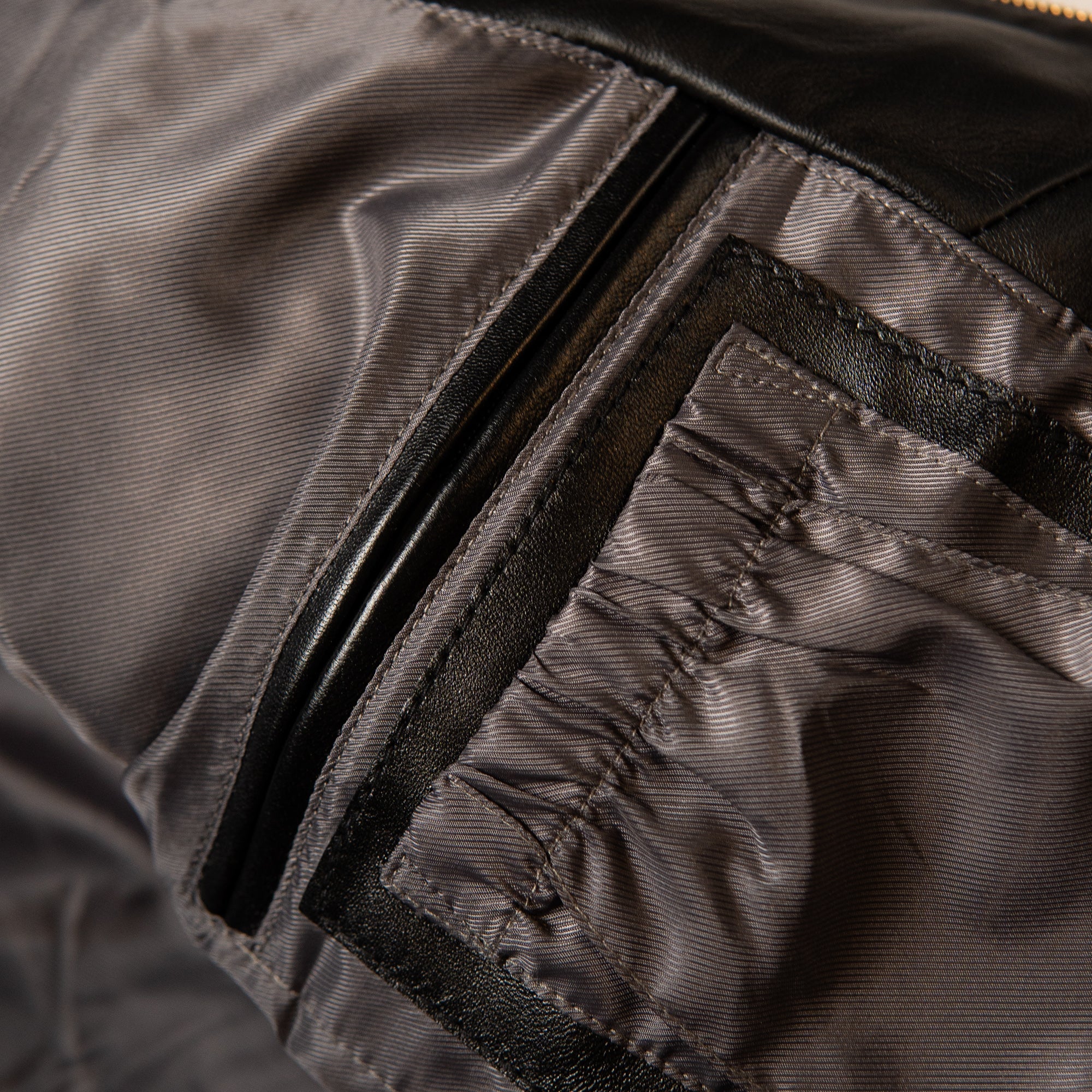 Pelle Pelle lettering above a decorated chest crest with 1978 numbers and red anniversary banners on black leather