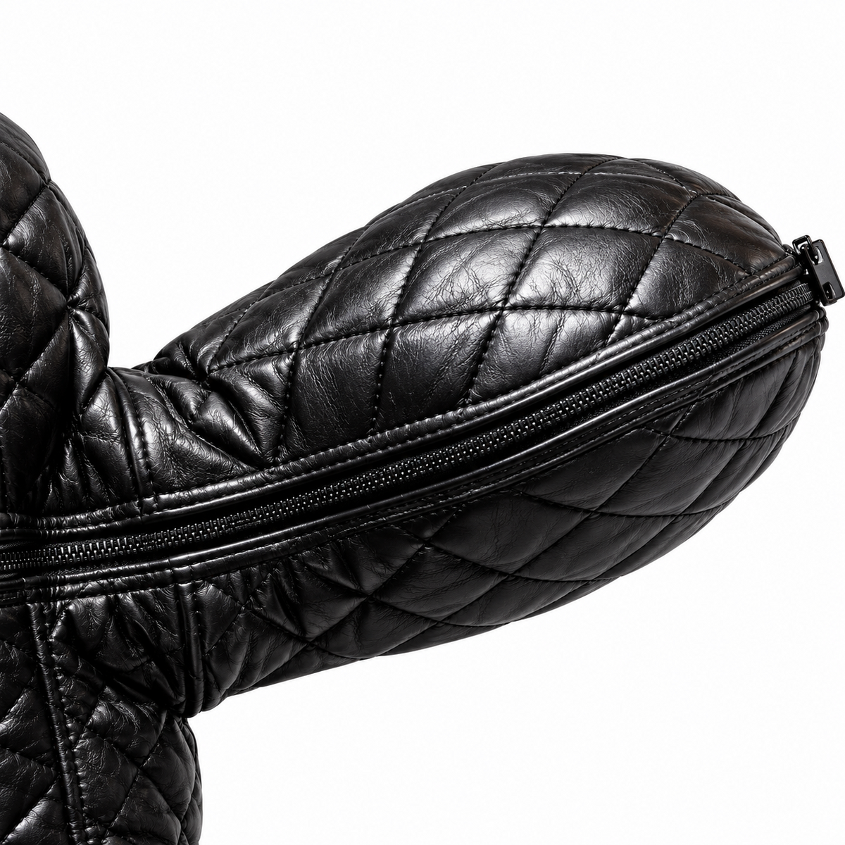 Close-up of quilted black leather hood section showing diamond stitching, edge piping and a dark zipper running along the curved panel seam.
