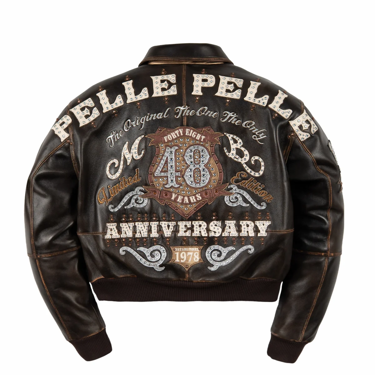 Women's distressed brown leather anniversary jacket, back view, with cream lettering, layered crest artwork, and reflective embellishments.