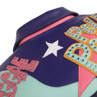 Upper-back detail of a multicolor leather music jacket showing purple and mint panels, a white star and embellished colored lettering.