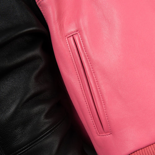 Women's pink and black leather varsity jacket, front pocket detail, featuring contrast panels and decorative lettering in the product photo.