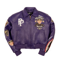 Women's purple leather bomber jacket, front view, with gold-toned embellishments, cream accents, and decorative crest artwork.