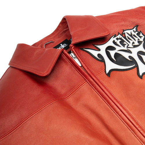Women's red orange gradient leather bomber jacket, collar and chest detail, showing contrasting black and white graphics and warm-toned panels.