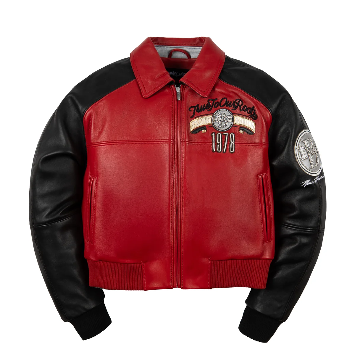 Women's red and black leather varsity jacket, front view, with contrasting panels, embroidered motifs, and reflective embellishments.