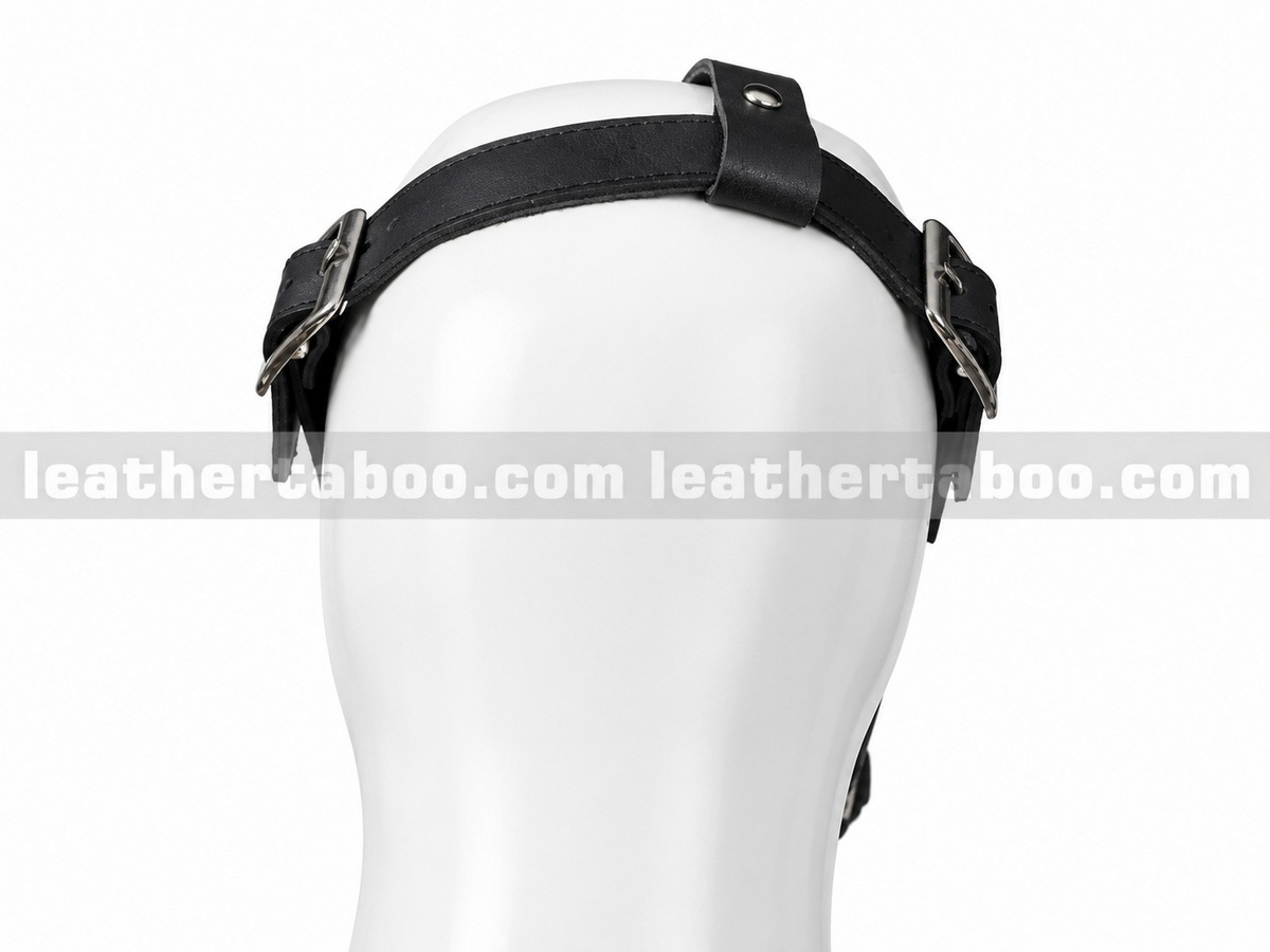 Rear view of black leather plague doctor mask straps showing twin silver-tone buckles, adjustment holes and a crown strap on a white mannequin.