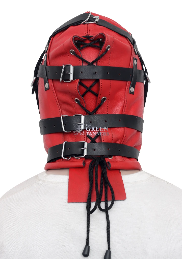 Rear view of red full-face leather hood with black cord lacing, three adjustable buckle straps and silver-tone hardware details.