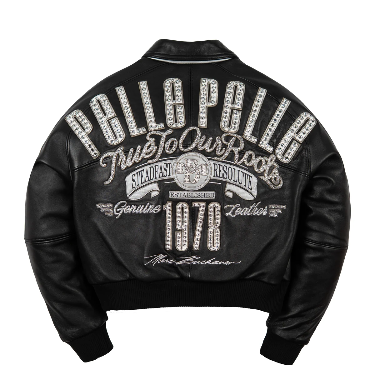 Rear of women's black leather jacket with large silver-tone lettering, decorative script, 1978 applique and matching ribbed waistband.